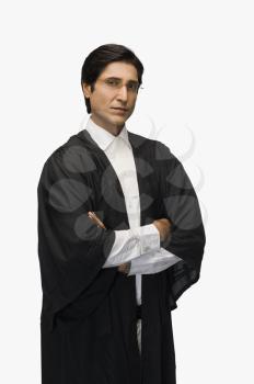 Portrait of a lawyer standing with arms crossed