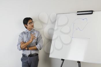 Teacher standing beside a whiteboard