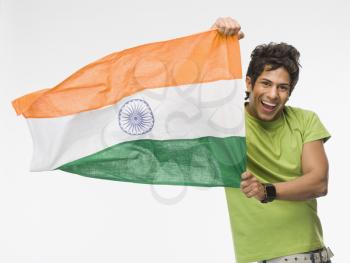 Portrait of a man holding Indian flag