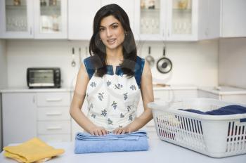 Woman folding laundry