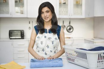 Woman folding laundry