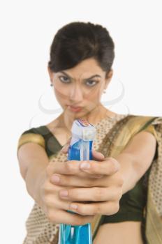 Woman holding a spray bottle