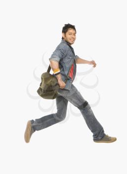 University student running with a shoulder bag
