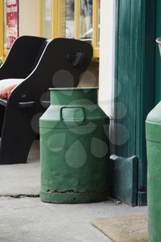 Milk canisters near the door of a restaurant, Killarney, County Kerry, Republic of Ireland