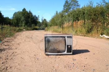 old television set on road