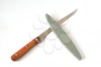 knife and emery on white background