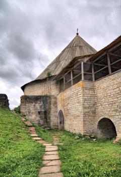 aging fortress on green hill