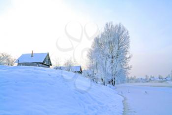 snow village on coast river