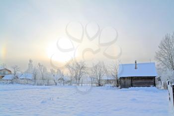winter sun on snow village