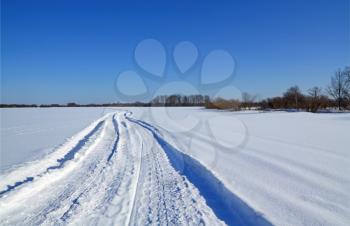 winter road on snow field
