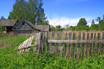 old fence near rural wooden building
