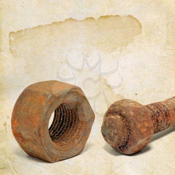 rusty bolt and nut on grunge background 