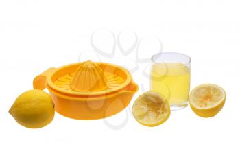 Juice extractor, lemon, juice in a glass on a white background.                    
