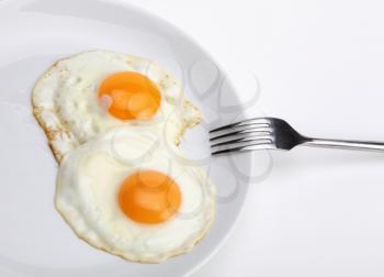 fried eggs with fork