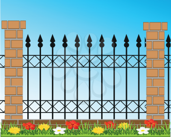 Decorative fence from ferric and brick on background of the nature