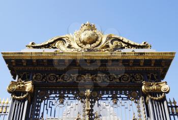 Golden decoration on main gate of Palace of Justice (Palais de Justice) in Paris, France 