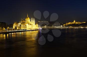 Cityscape of Budapest at night. Hungarian Parliament building, Buda castle and Chain bridge above Danube river.