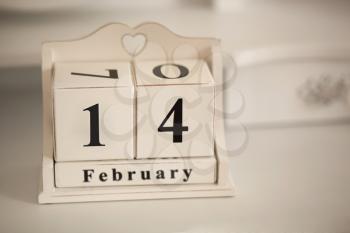 February 14 vintage calenda with a hole in the shape of heart. A holiday - Valentine's Day