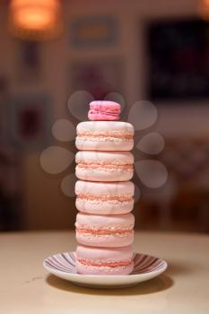 Tower of macaroons on a beautiful vintage table.