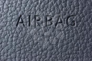 Inscription airbag on the steering wheel in the car very close-up.