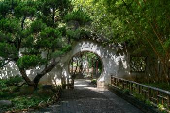 Ancient traditional garden, Suzhou garden, in China. Translation: like a curve. Photo in Suzhou, China.