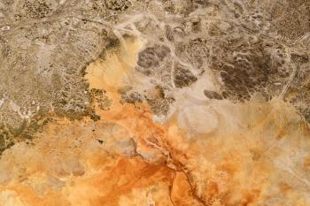Texture of the ground with orange color. Photo in Qinghai, China.
