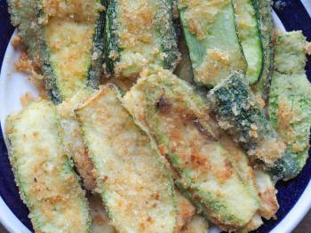 breaded courgettes (Cucurbita pepo) aka zucchini vegetables vegetarian and vegan food