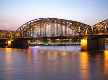 Hohenzollernbruecke (meaning Hohenzollern Bridge) crossing the river Rhein in Koeln, Germany
