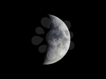 First quarter moon seen with an astronomical telescope