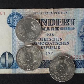 100 Mark banknote from the DDR (East Germany) with 1 Mark coin - Note: no more in use since german reunification in 1989