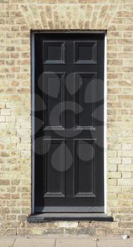 black traditional entrance door of a British house