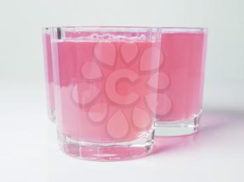 Pink grapefruit juice glasses on continental breakfast table