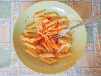 Italian penne pasta dish with tomatosauce