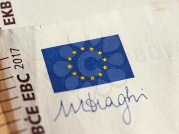 Detail of European Union flag and ECB governor signature on 50 Euro banknote money (EUR), currency of European Union