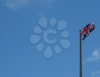 national flag of the United Kingdom (UK) aka Union Jack over blue sky with copy space
