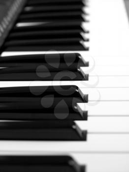 Detail of black and white keys on music keyboard - selective focus