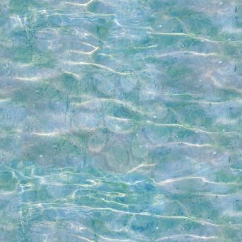 seamless tileable blue water texture useful as a background