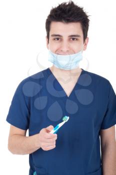 Royalty Free Photo of a Dentist Holding a Toothbrush