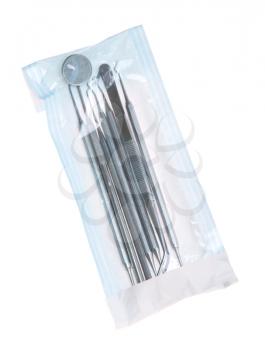 Royalty Free Photo of a Dentistry Kit in a Sterilized Pouch