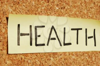 Royalty Free Clipart Image of Health Note on a Board