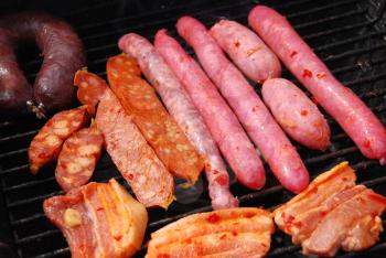 Royalty Free Clipart Image of  Meat on a Grill