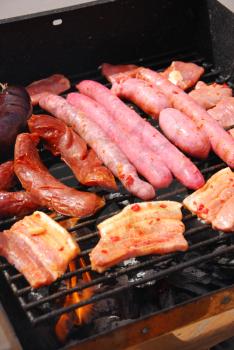 Royalty Free Clipart Image of  Meat on a Grill