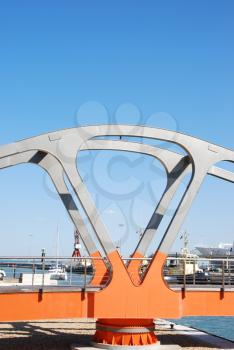 Royalty Free Photo of an Orange Bridge for People at the Docks in Lisbon, Portugal