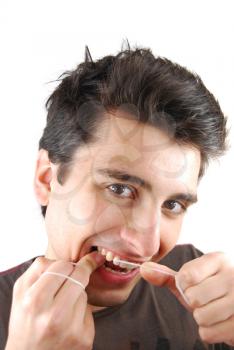 Royalty Free Photo of a Man Flossing
