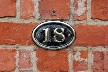 Royalty Free Photo of a Metallic Number Hanging on a Wall