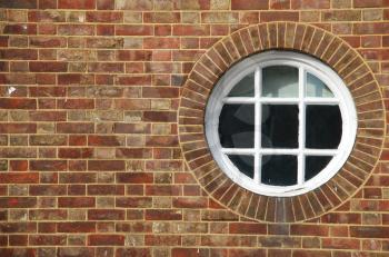 Royalty Free Photo of a Window in a Brick Wall