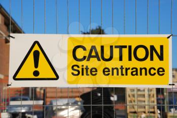 Royalty Free Photo of a Caution Site Entrance Sign