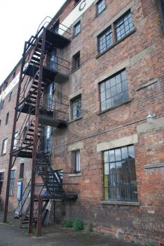 Royalty Free Photo of Rusty Fire Escape Stairs on a Building