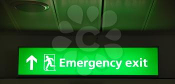 Royalty Free Photo of an Emergency Exit Sign at an International Airport