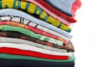 Royalty Free Photo of a Pile of Colorful T-Shirts